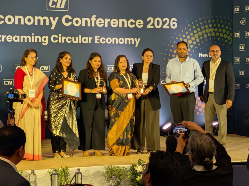 Lucro and partner teams on stage with both CII Sustainable Plastic Packaging Awards 2026 trophies